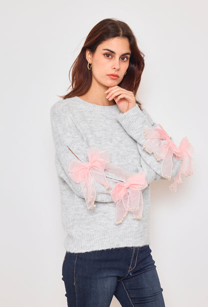 Sweater with ribbons and rhinestones on the sleeves