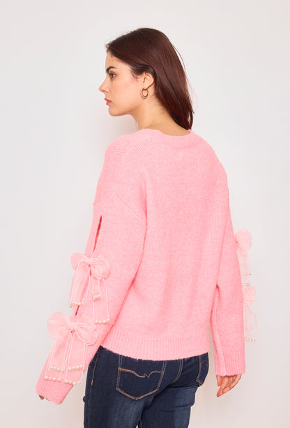 Sweater with ribbons and rhinestones on the sleeves